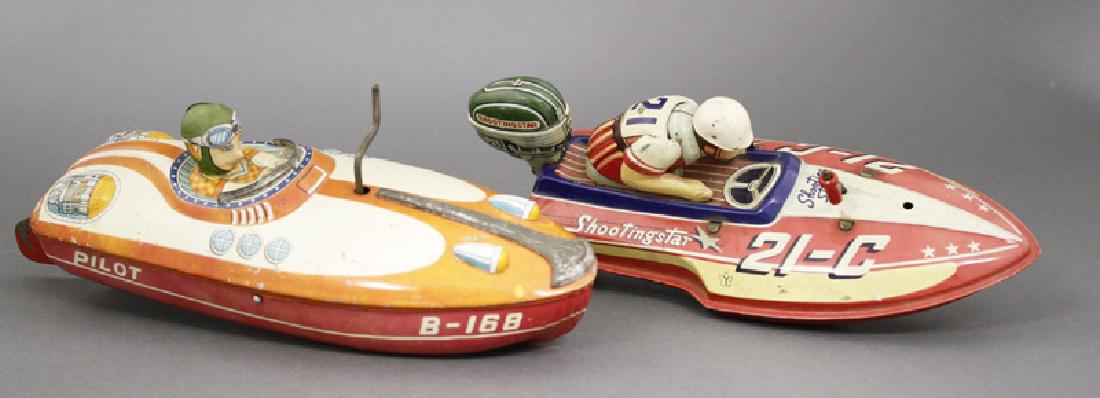 Racing Boats: Japanese - Circa 1950’sOne marked “Shooting Star” is 9.5” long and the other marked “Pilot” is 11” long. Both work extremely well. Material: Tin