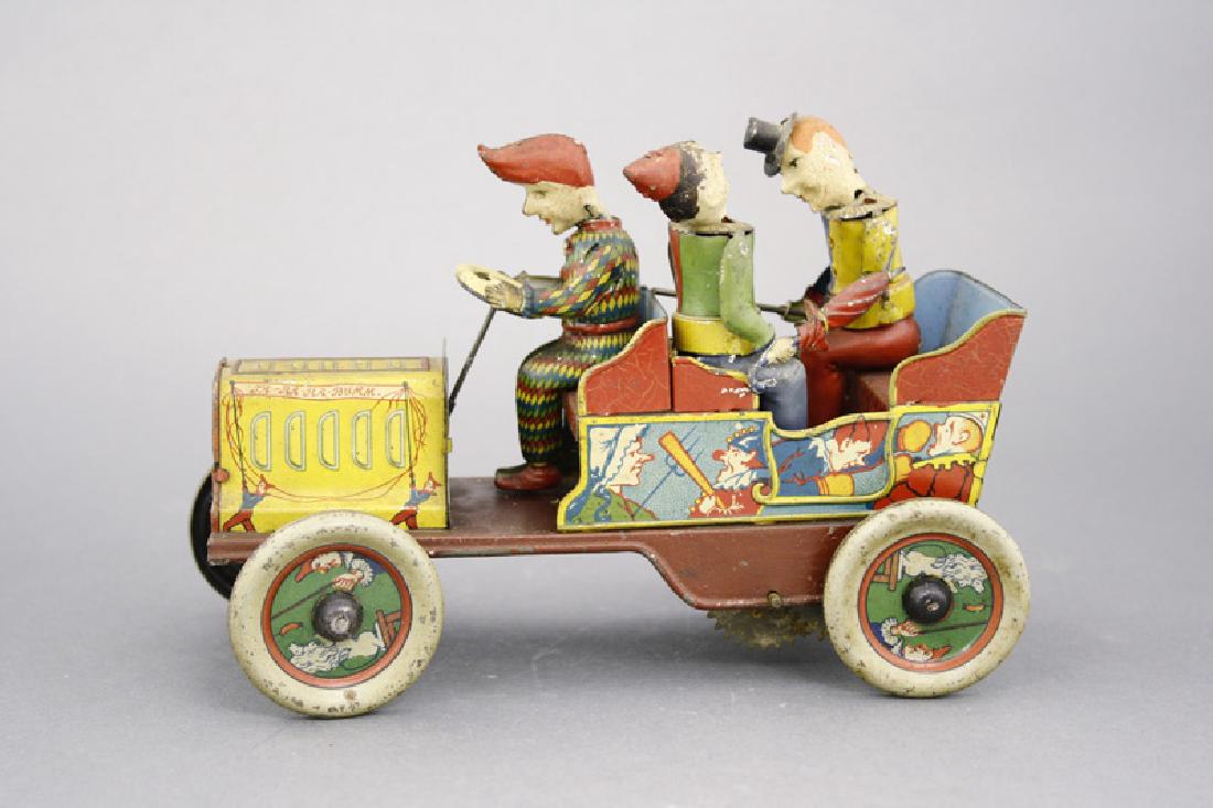 “Clown” Car: Made by Hans Eberl Germany - Circa 1920’s - 7.5” Long This is a rare and highly sought after German windup toy. It is in excellent, all original, and good working condition. Material: Tin