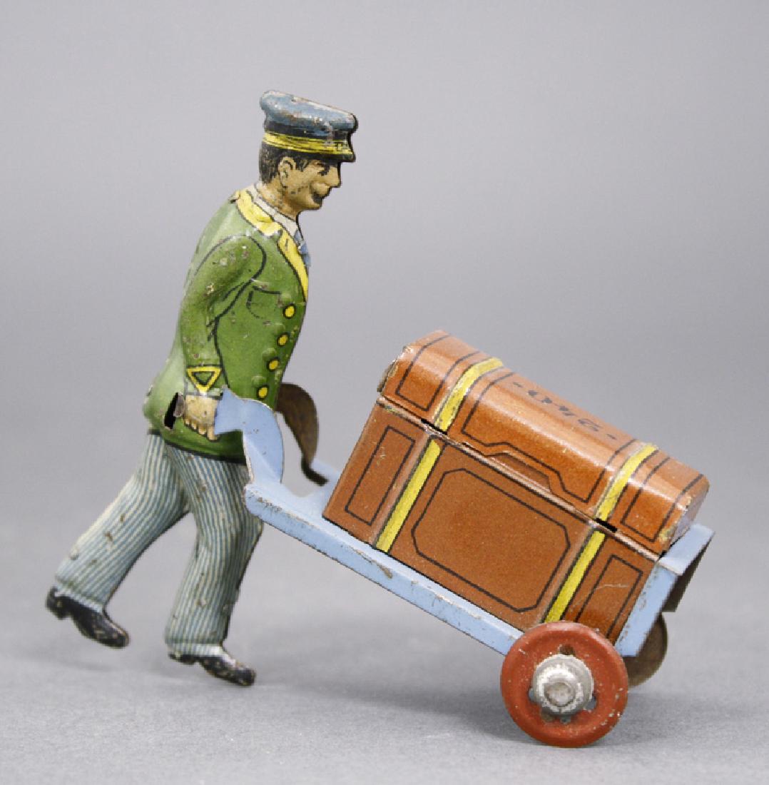 Porter Pushing Trunk (1 of 1)