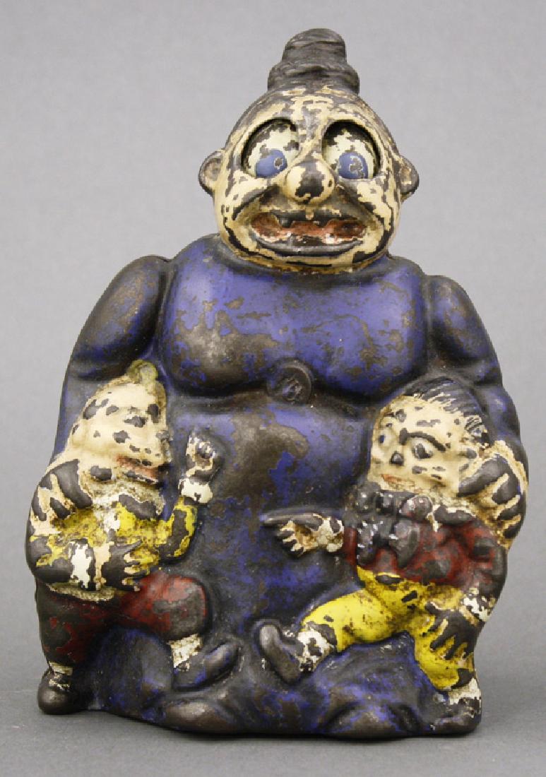 Mama Katzenjammer Bank: Kenton Hardware Kenton, Ohio - Circa 1910 Kenton made very few mechanical banks. This one is based upon the Katzenjammer Kids comic strip. Her eyes roll when coins are deposited. Material: Cast Iron