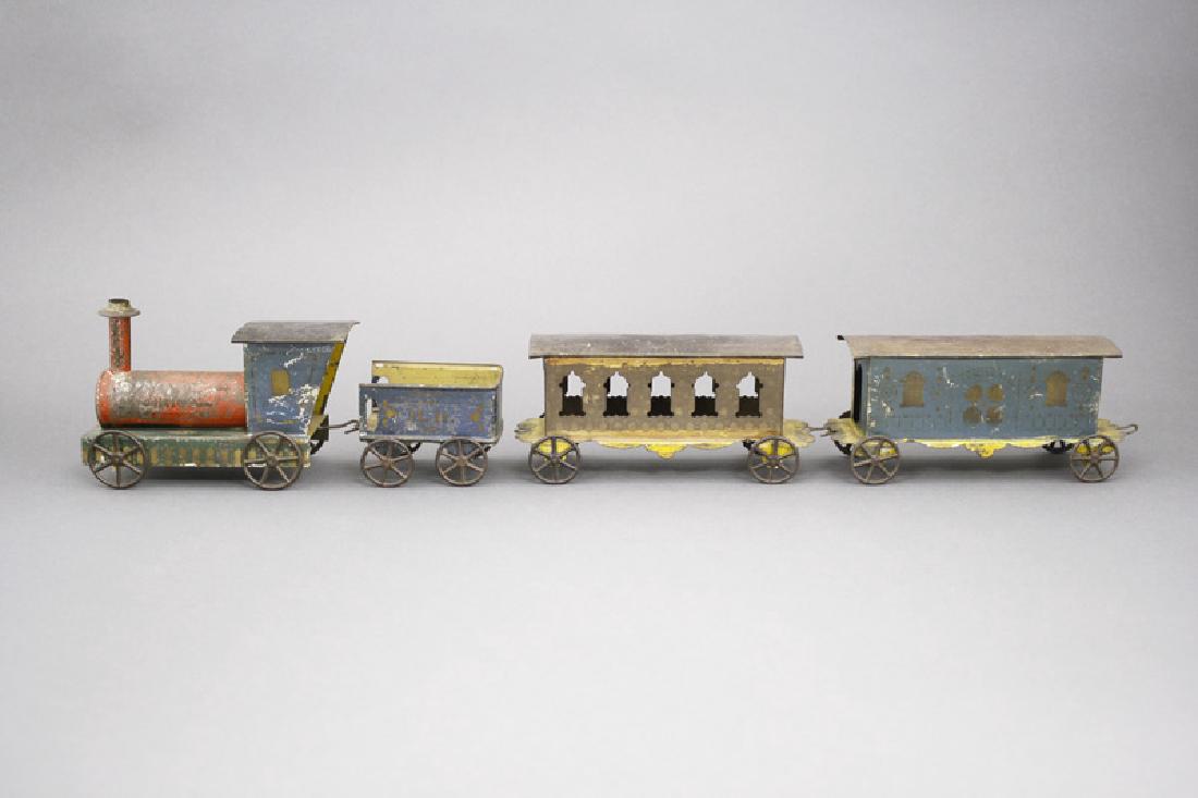 The “Orion” Train: Merriam Mfg. Co. Connecticut - Circa 1870’s - 22” Long This is a charming American tin train in bright colors. Material: Tin