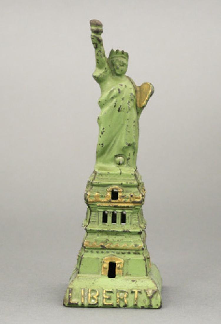 Statue of Liberty - Medium – Green: Kenton Hardware Ohio - Circa 1915 Green examples are scarce. Material: Cast Iron