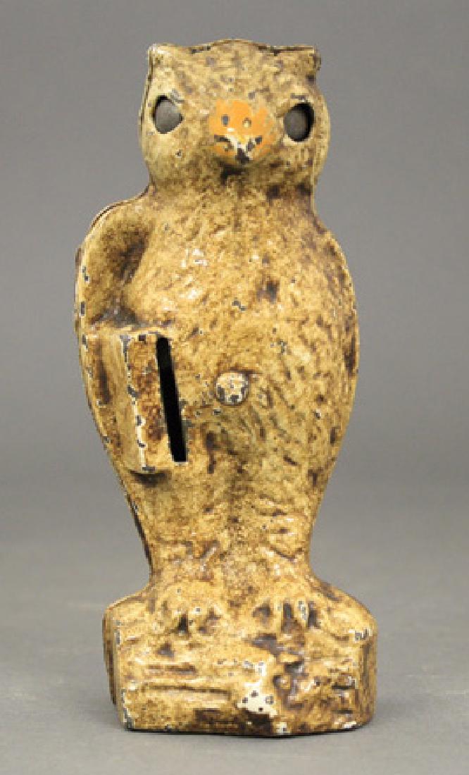 Owl, Slot in Book: Kilgore Mfg. Co. Westerville, Ohio - Circa 1925 Place a coin in the owl’s book and his eyes blink. He was originally marketed as “Blinkey” the owl. Material: Cast Iron