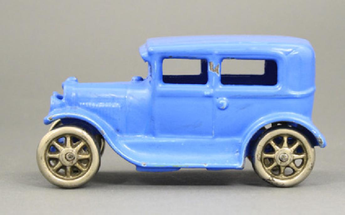 Blue Sedan: Arcade Mfg. Co. - 5” L Freeport, Illinois - Circa 1925 Material: Cast Iron