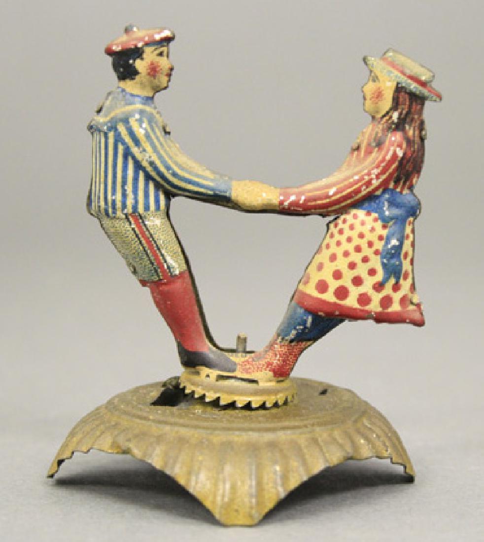 Very Scarce and Significant A Boy and Girl Playing Ring: J.P. Meier - Germany - 1900’s Illustrated as #382 in Pressland Material: Lithographed Tin