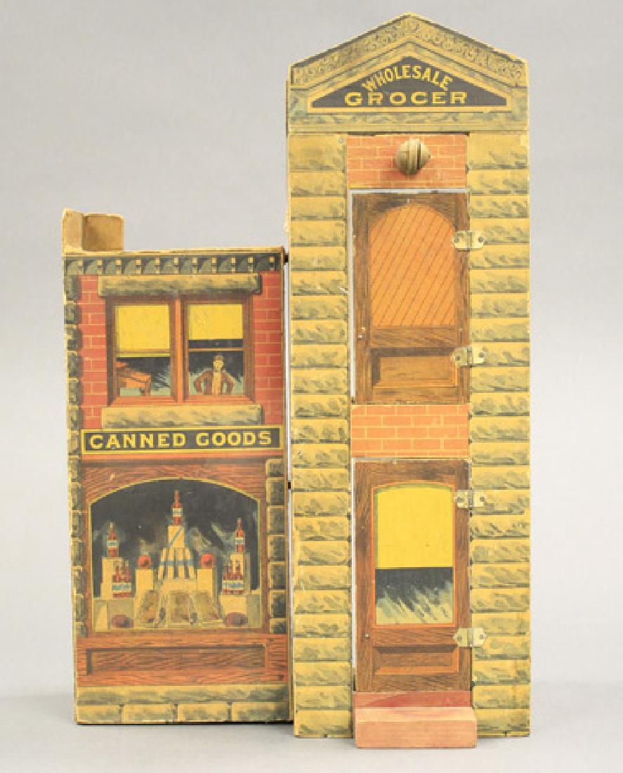 “Wholesale Grocer”: Probably Bliss American - Circa 1890 15.5” H x 10” W x 5.75” D Material: Wood and Paper