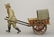 Man Wheeling a Cart
