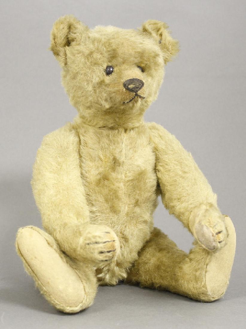 Brown Bear: Margaret Steiff Co. Germany - Circa 1910. 13" Tall. This cute bear is in very fine overall condition. His pads to his upper legs have some minor tears. His growler is present but doesn't work. The Ste