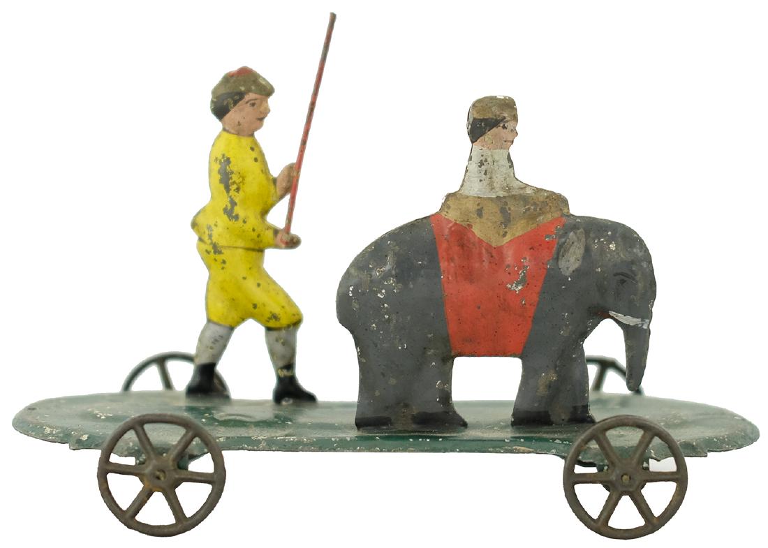 Baby Elephant with Handler: Probably James Fallows Philadelphia - Circa 1885 - 6" L The base incised with the word "Chester". Both figures have substantial restoration. Tin