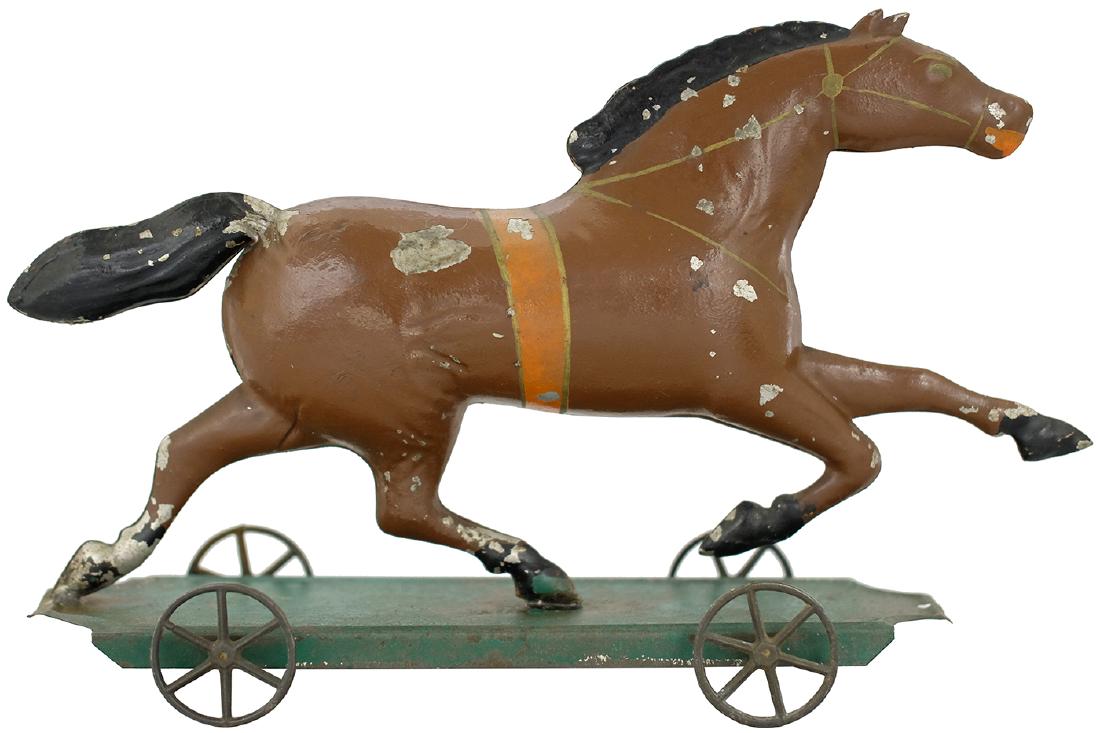 Running "Dexter" Horse: George W. Brown Co. Forestville, CT. - Circa 1880's - 11.25" L This is one of the most impressive tin platform toys produced by George Brown. It also happens to be in superb condition. Tin