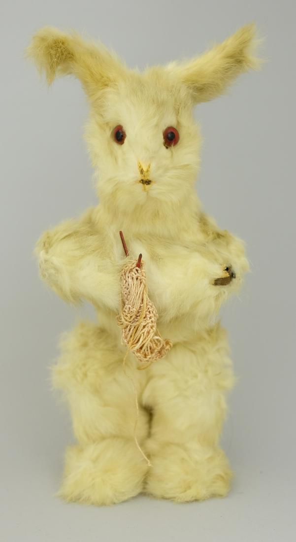 Knitting Bunny: DeCamps French - Circa 1920's - 13.5" H This cute little guy is in excellent and good working condition. One rub on his left elbow. Tin, Fur and Fabric