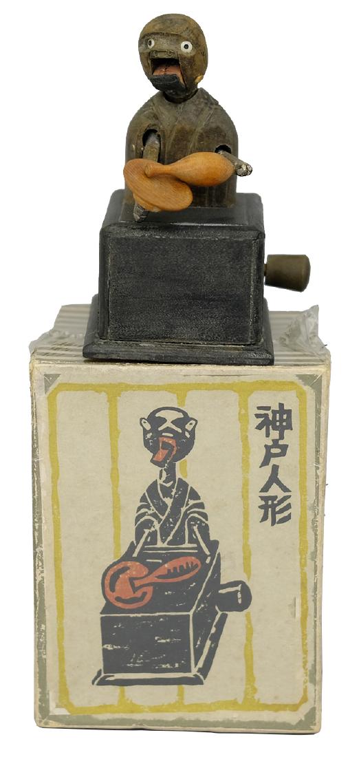 Classic Sake Drinker: ; Japanese - Circa 1940. It is completely unprecedented to find a Kobe Toy presented with its original box.