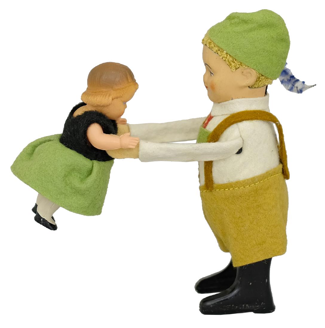 Dancing Bavarian Kids: Made by Schuco Toys; Germany - Circa 1930’s.