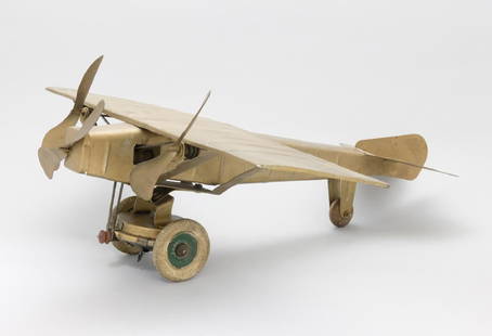 Trimotor Airplane: Kingsbury Mfg. Co. Keene, NH - 1927 - 15†L x 15†Wingspan This is a very fine example of the toy. Its mechanism works well. Tin with Rubber Tires
