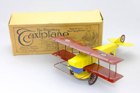 Taxi Plane with Original Box: Kingsbury Mfg. Co. Keene, NH - 1918 - 15.5â€ L x 12â€ Wingspan This toy is in Near Mint and bright condition. The box is in excellent condition with its original direction sheet. Tin, Iron and R