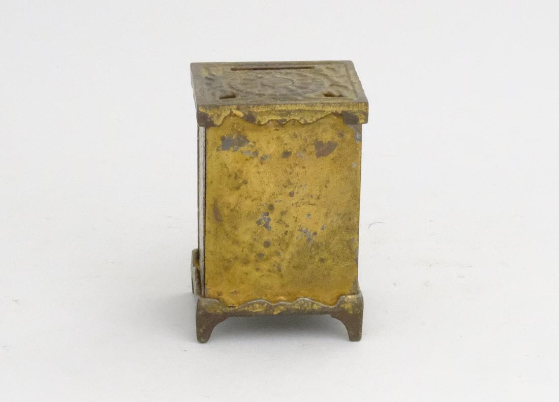 Safe No. 50: Arcade Mfg. Co. Freeport, IL - 1902 - 2.75" T A scarce, obscure little safe bank. Cast Iron / Tin