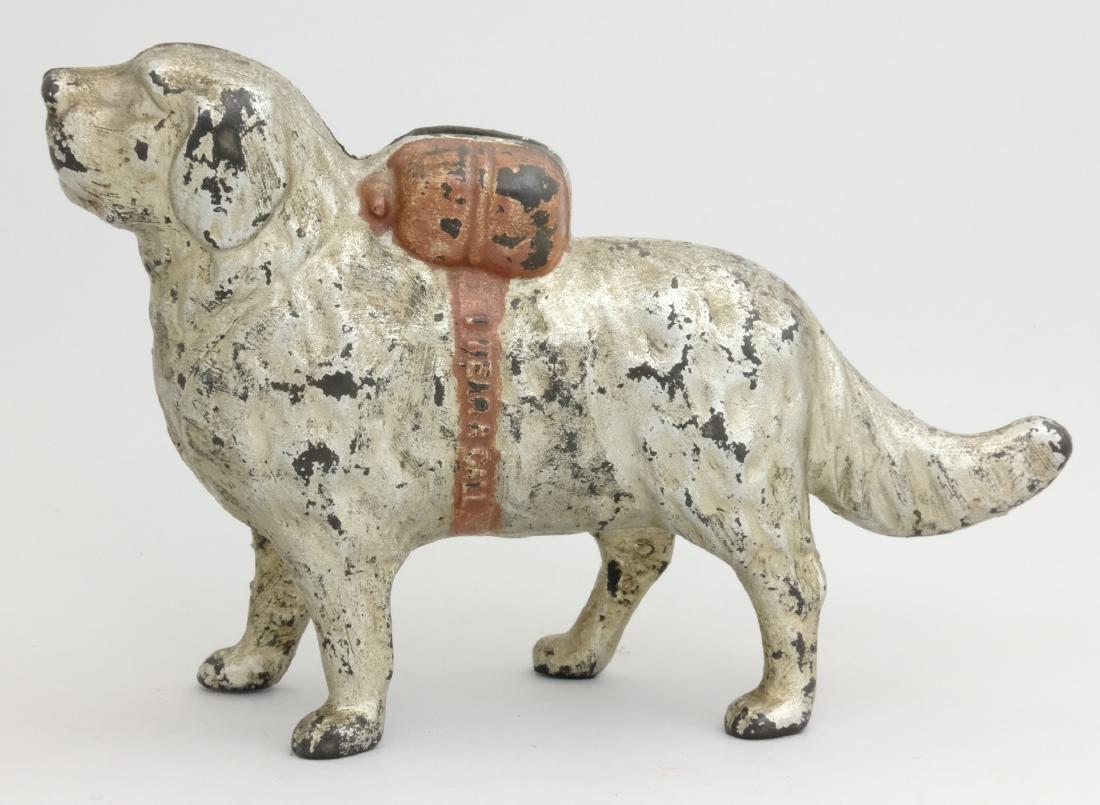 Water Spaniel with Pack - Paint Variation: A. C. Williams Ravenna, OH - 1910 This is a scarce paint variation in silver with brown pack. Material: Cast Iron