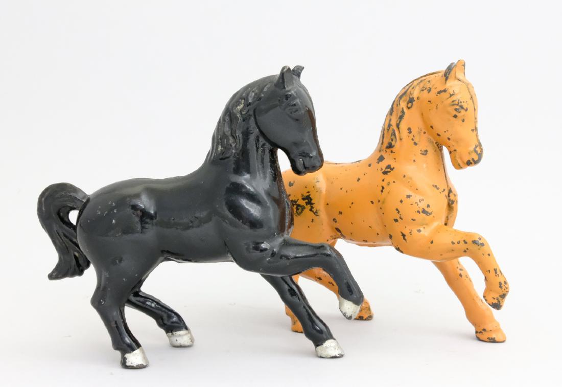 Prancing Horses: A. C. Williams Ravenna, OH - 1920's The Orange painted example is very scarce. Material: Cast Iron