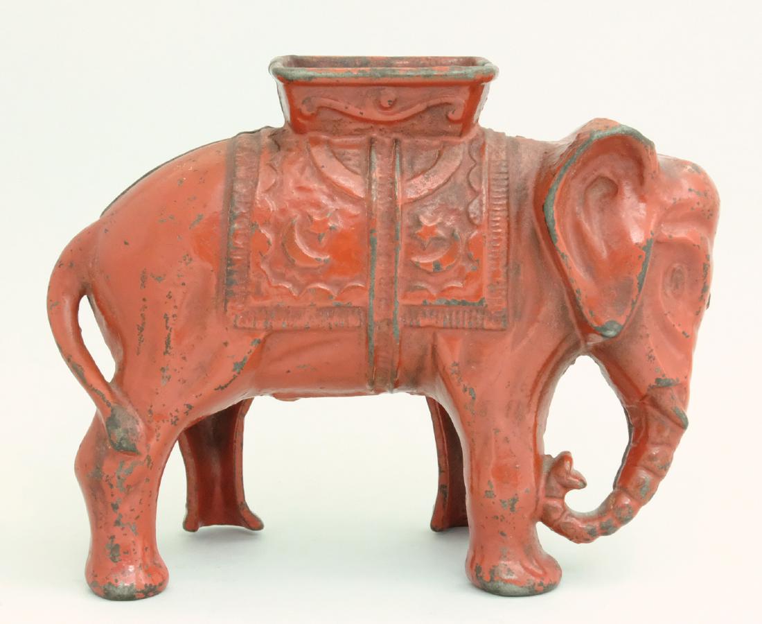 Elephant with Howdah - Large, Red: A. C. Williams Ravenna, OH - 1920's Ninety percent of these banks were painted gold. Red is very scarce. Material: Cast Iron