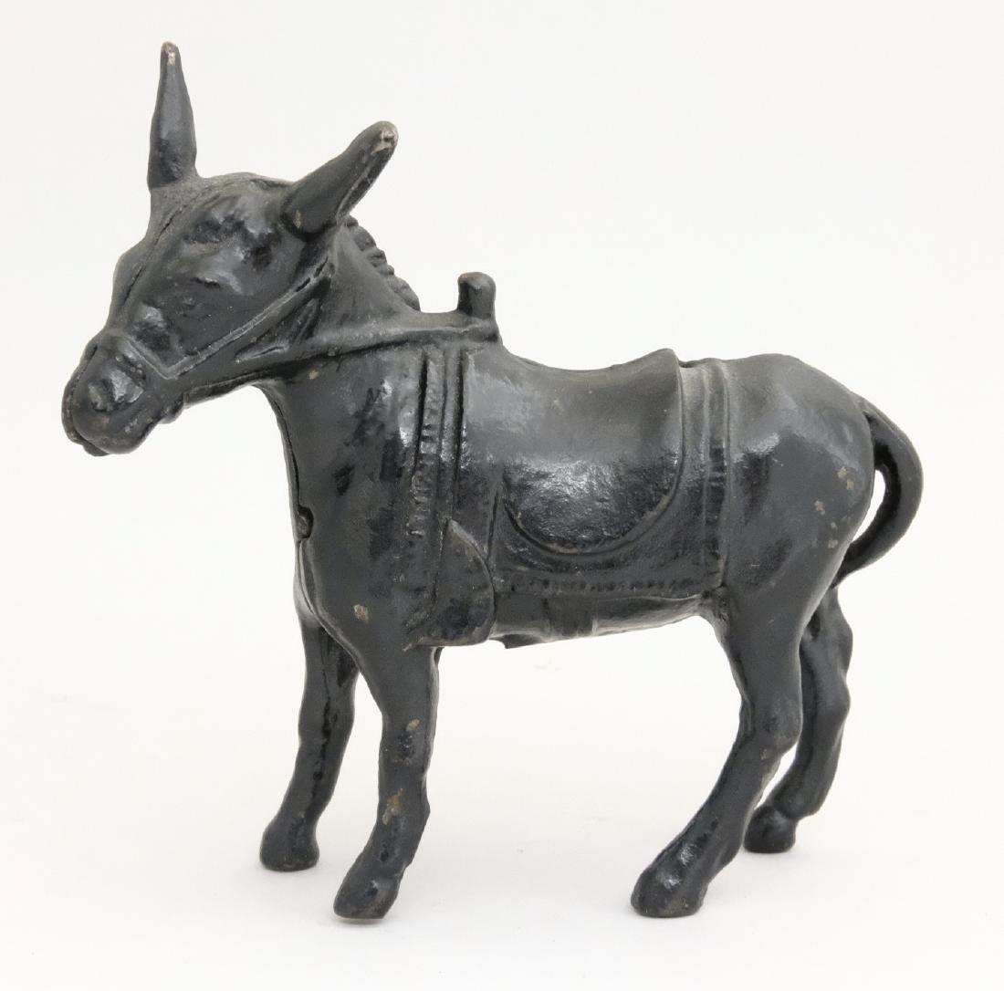 Donkey - Small, Black: Arcade Mfg. Co. Freeport, IL - 1920 A very scarce color variant. Material: Cast Iron