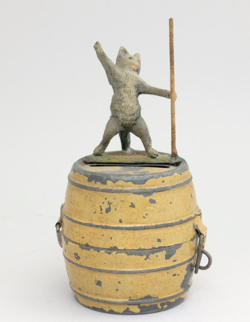 Cat with Staff Atop Barrel: Germany - 1920 - 4.375" T This is a very rare Germany spelter bank. PGSB#214 Material: Tin and Spelter
