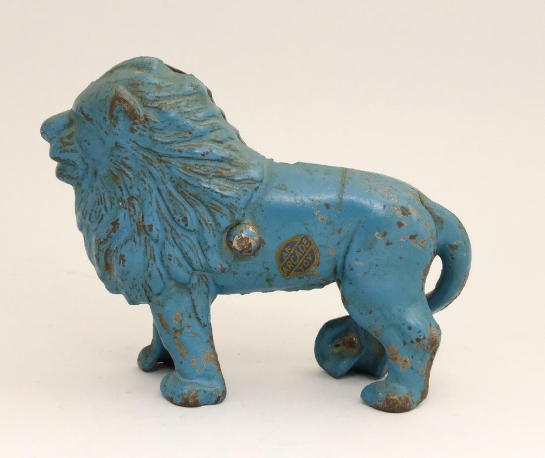 Lion Ears Up (Turnpin): Arcade Mfg. Co. Freeport, IL - 1920 Scarce in Blue with an intact Arcade label. Material: Cast Iron
