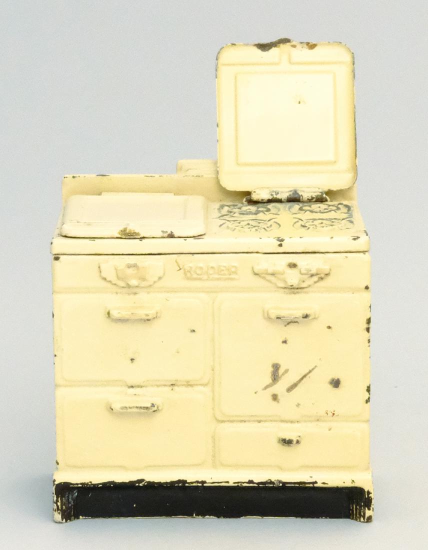 "Roper" Stove - Covers Lift: Arcade Mfg. Co. Freeport, IL - 1934 Material: Cast Iron and Sheet Steel