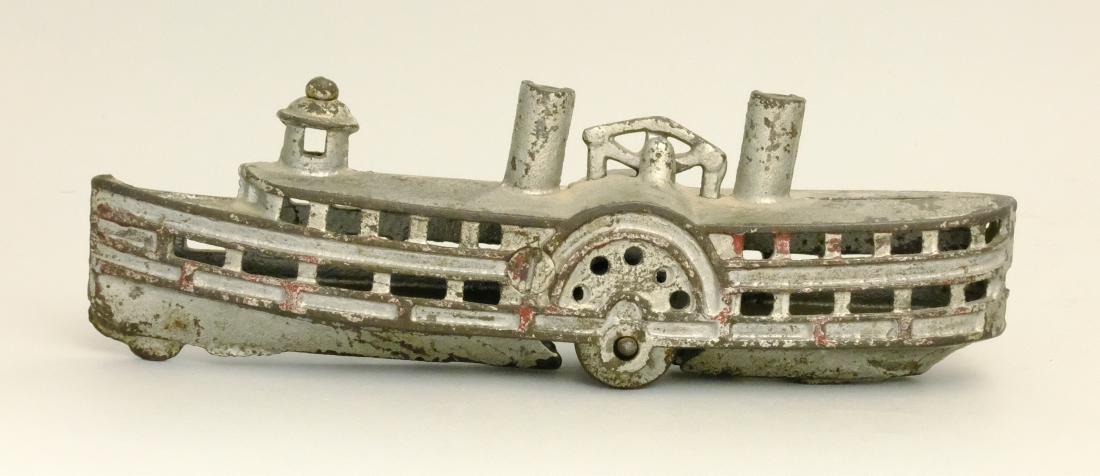 Steamboat with Small Wheels: Possibly Kenton Hardware American - 1915 This bank is seldom seen. It is the first we have sold. Material: Cast Iron