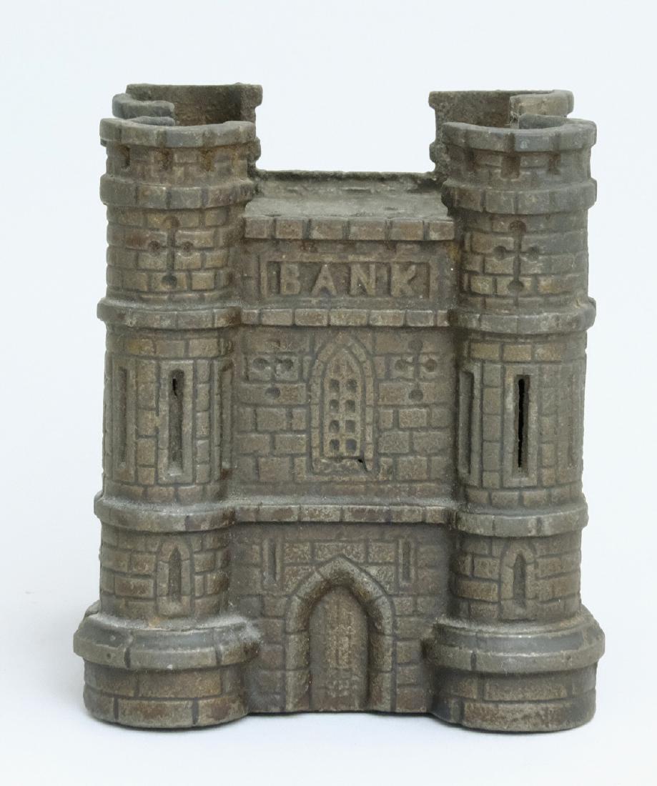 Castle: John Harper Ltd. England - 1910 This is a really tough little building bank to find. Material: Cast Iron