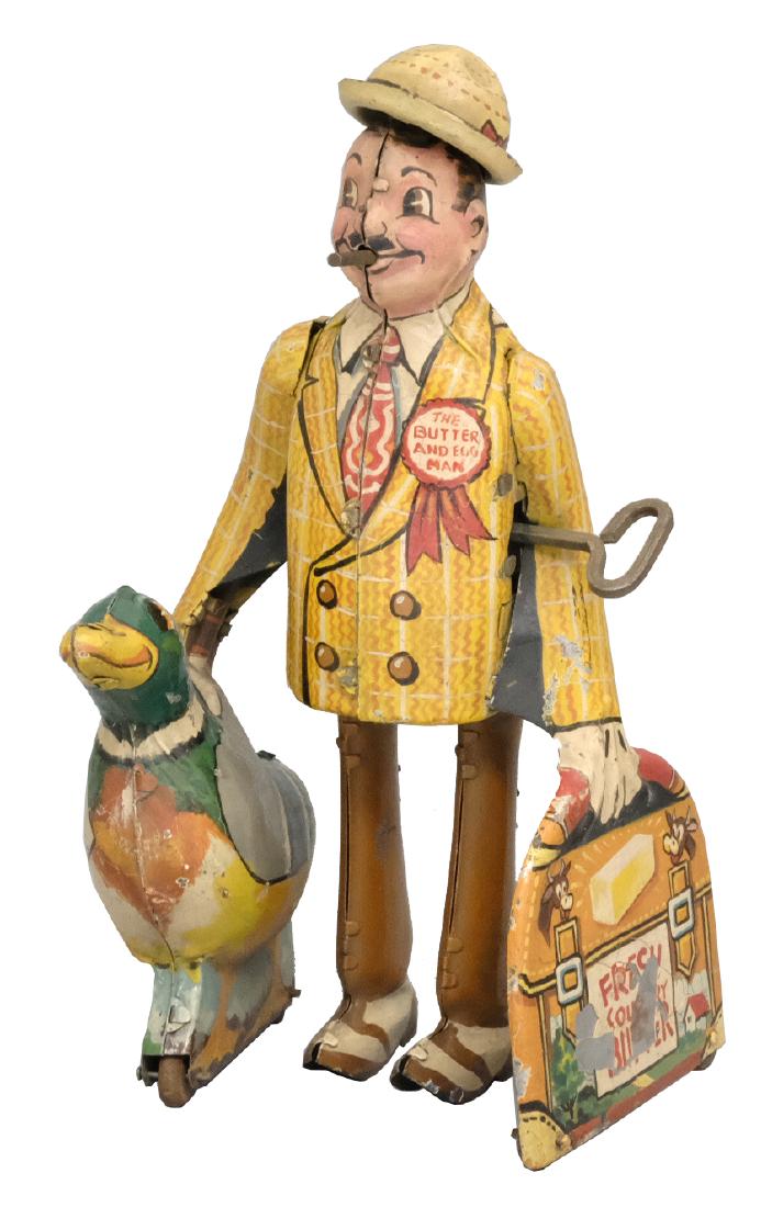 Butter and Egg Man, Prototype: Louis Marx & Co. New York, NY - Circa 1930's We believe that this is the prototype for this toy, as it employs an actual Joe Penner toy, similar in design with hand painted details over the lithograph