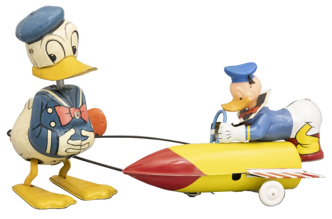 Two Donald Duck Toys: LineMar Toys Japanese - Circa 1950's/60's The walker uses kinetic energy for its movement. The rocket ship is friction driven. Material: Tin