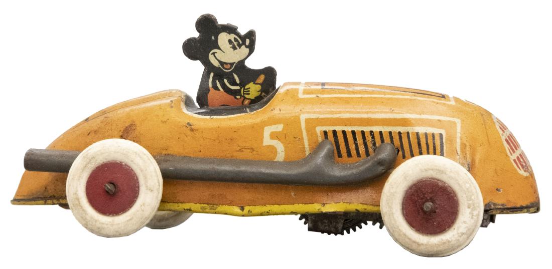 Mickey Mouse in Race Car: German - Circa 1930's This is a scarce toy. Material: Tin