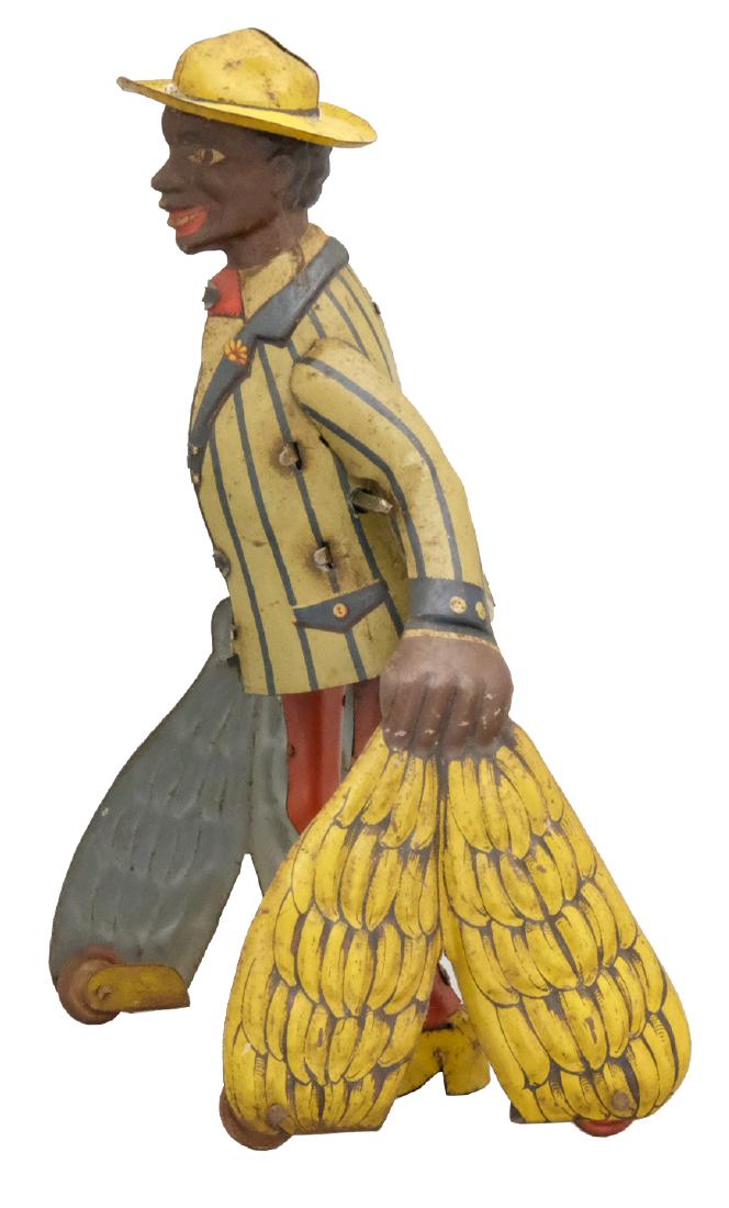 Banana Merchant: J. Distler Nuremburg, Germany - Circa 1920's - 7.5" T A very scarce Distler toy. Works very well. Material: Tin