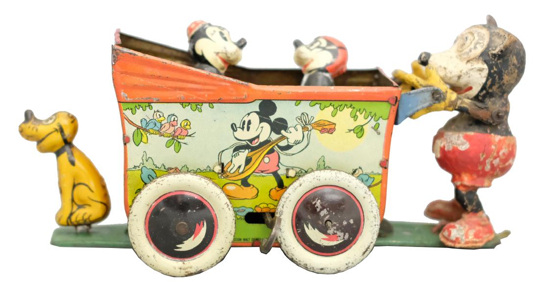 Mickey Mouse & Pluto Carriage: Wells Mfg. Co. England - Circa 1930's - 7" L A very scarce early Mickey Mouse toy. Made with the permission of Walt Disney Company. The toy works quite well. Material: Tin and Composition