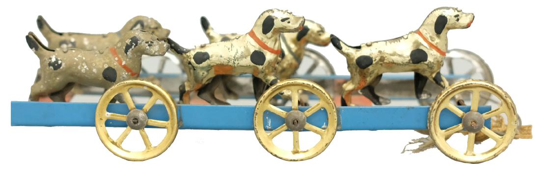 Hound's Pull Toy: German - Circa 1920's - 9" L This pristine and graphic toy works very well. As the toy is pulled, the dogs go up and down. Material: Tin