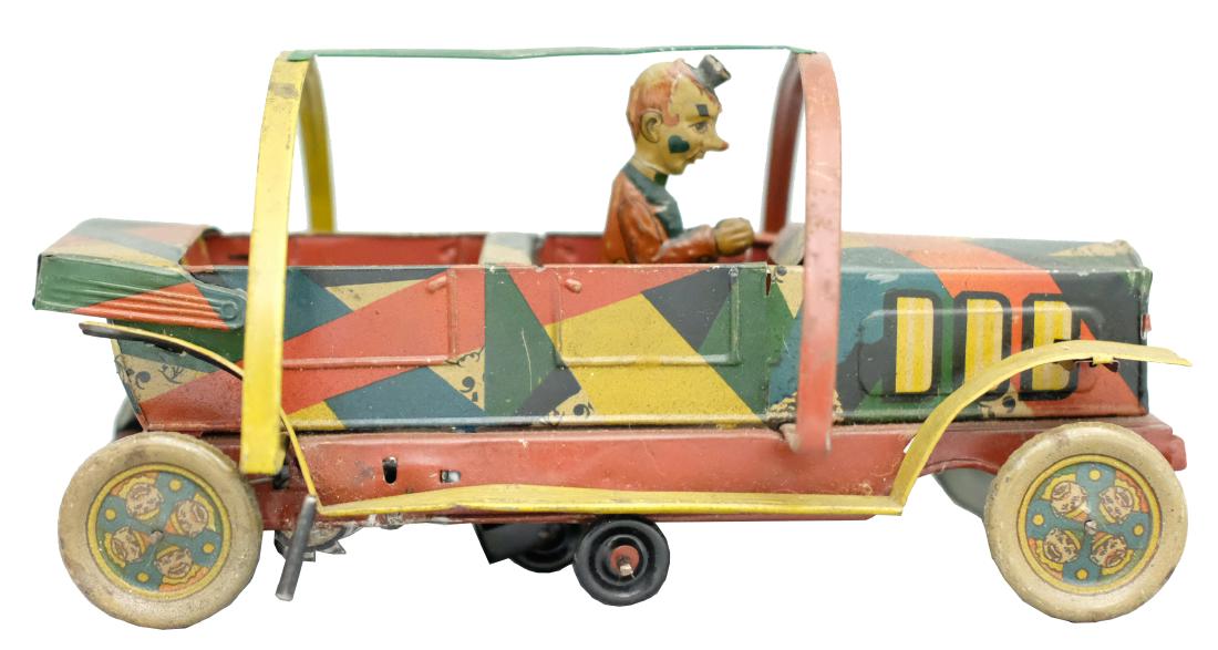 Clown Rollover Car: Hans Eberl German - Circa 1920's - 10" L Colorful and scarce, comical car that works well. Material: Tin
