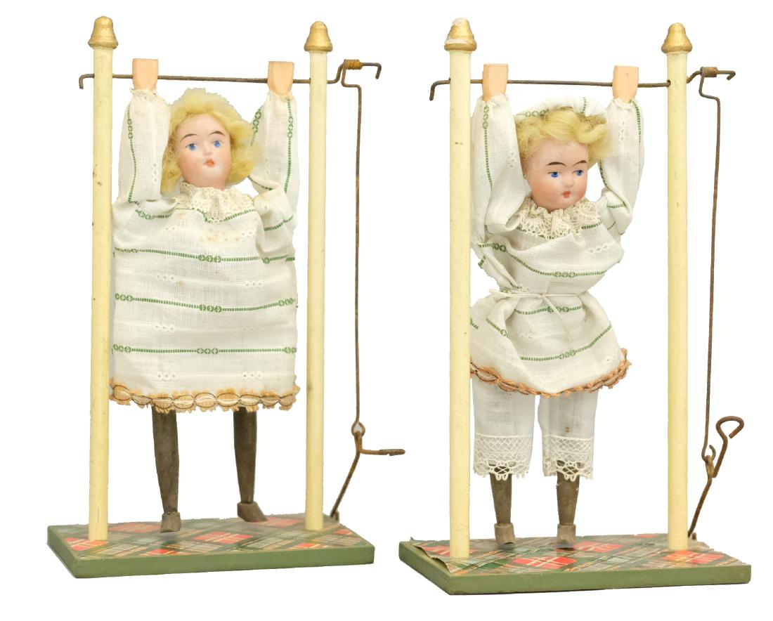 Two Girl Trapeze Artists: German - Circa 1905 - 9" T Press the lever and they fly backwards to an inverted position. They work well. Material: Wood, fabric, and bisque