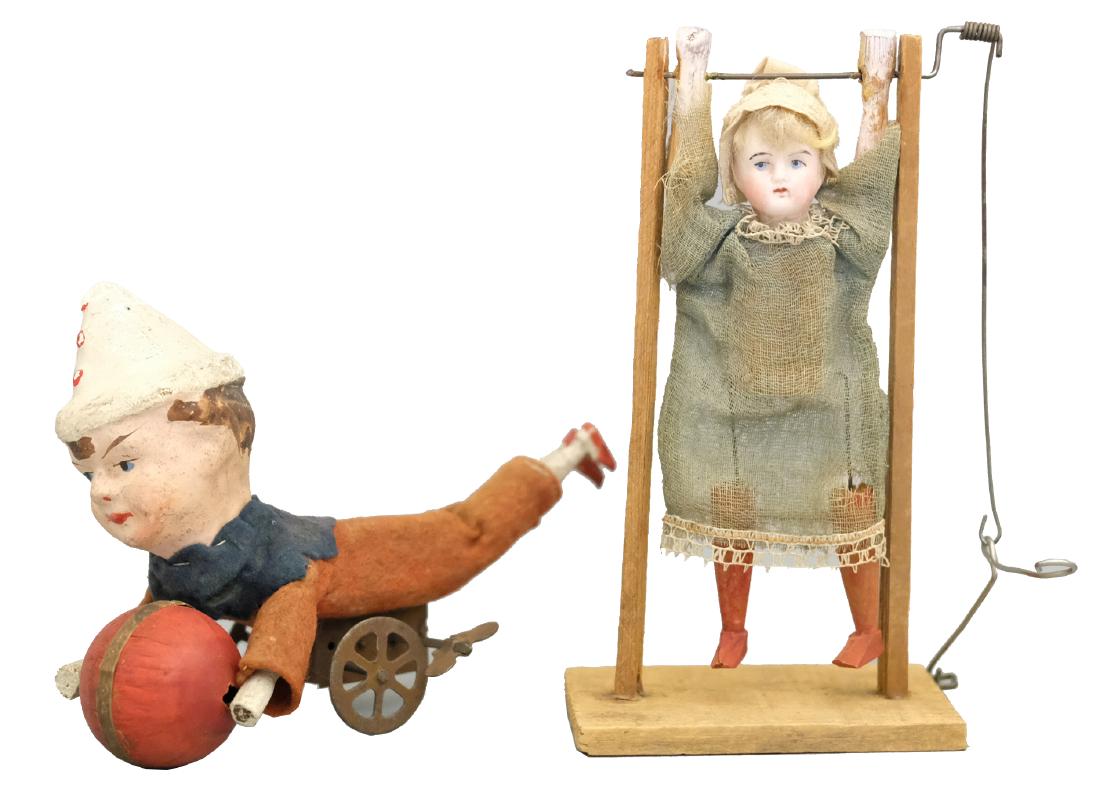 Girl Acrobat/Prone Clown with Ball: German - Circa 1920 - 7.25" T/6.75" L Both of these toys work well. Material: Composition, wood, and fabric