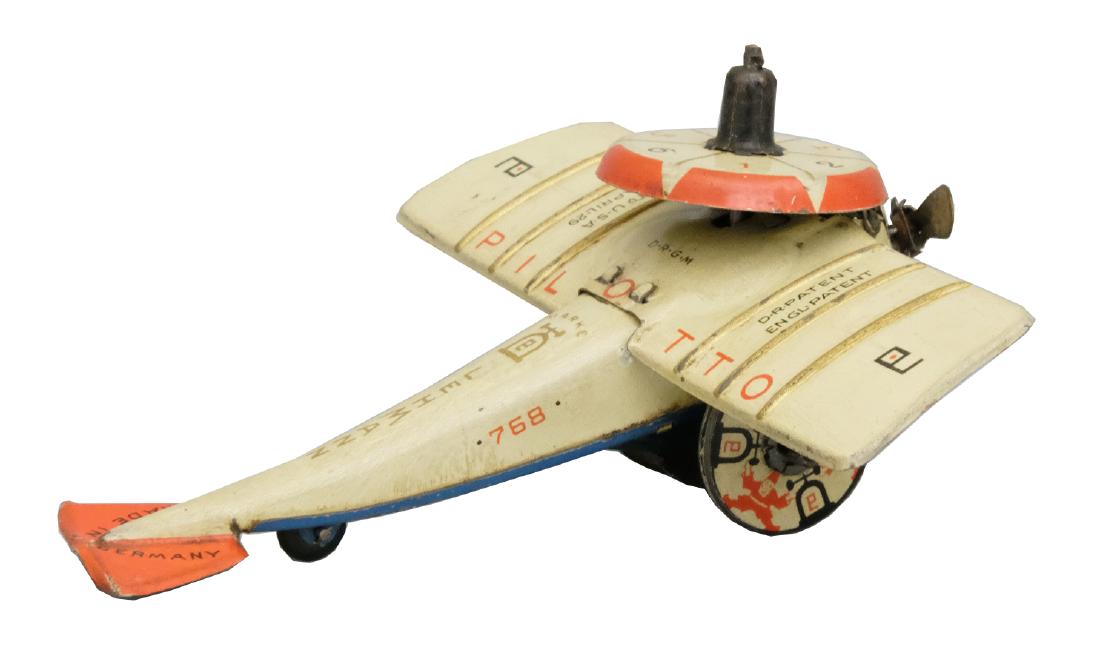 "Pilotto" (EPL No. 768): Production Run: 1929-1941 This is a gyroscopic driven little airplane. The Pilotto is a fairly scarce Lehmann toy. Material: Tin