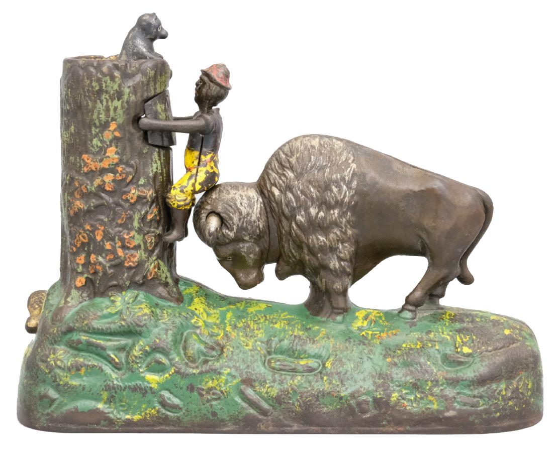 Butting Buffalo: Kyser & Rex Philadelphia, PA - Circa 1888 This colorful and highly desirable bank was made by Kyser & Rex. The not so subtle bigotry of this bank involves a black boy being butted up a tree to come fa
