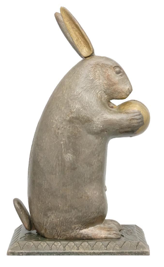 Rabbit Standing - Large: Lockwood Mfg. Co. South Norwalk, CT - Circa 1882 Place a coin in the ball and depress the rabbit's tail. The ears move and the coin is deposited. This is truly an outstanding example. Material: Cast I