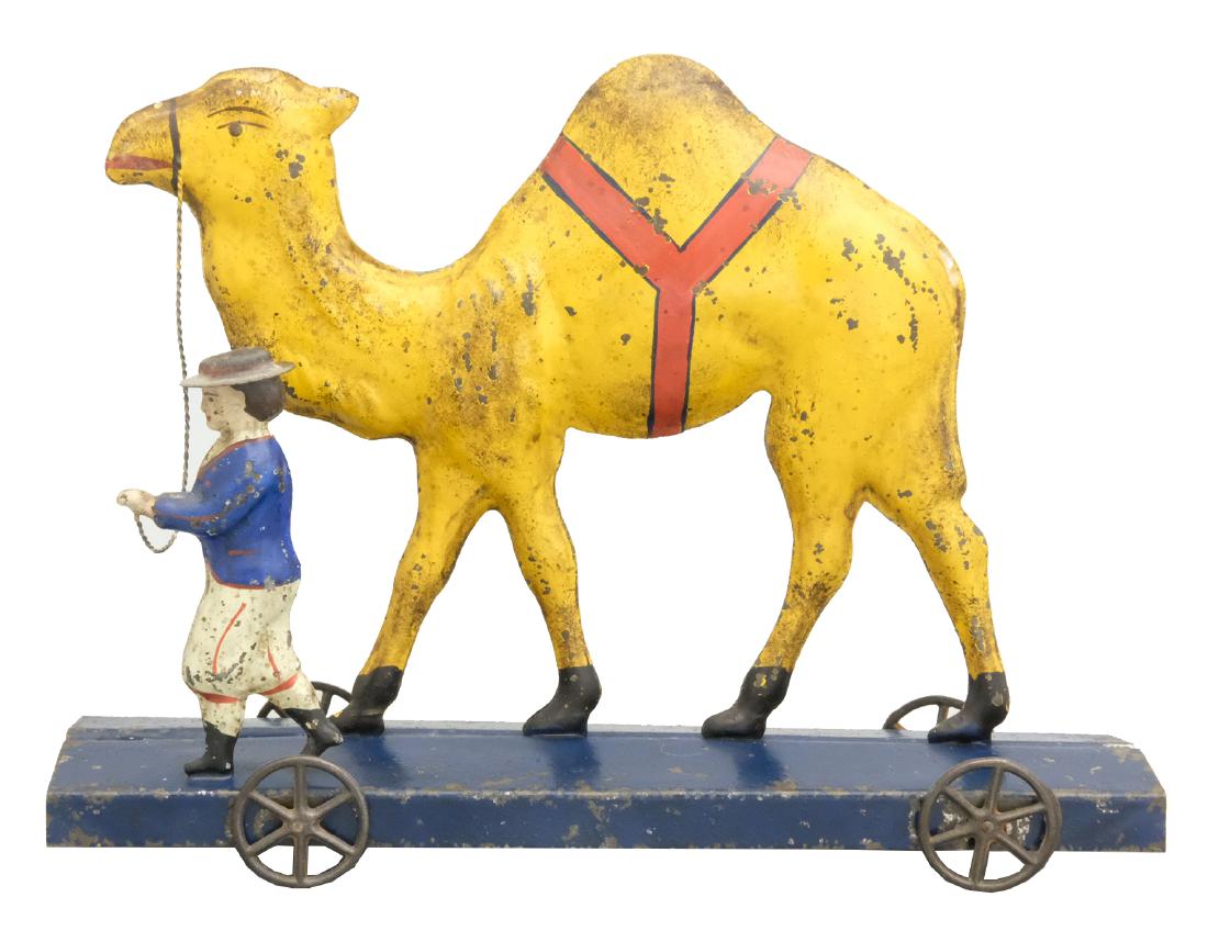 Camel with Handler Pull Toy: James Fallows Philadelphia, PA - Circa 1880's - 9" L A scarce and colorful toy. Material: Tin