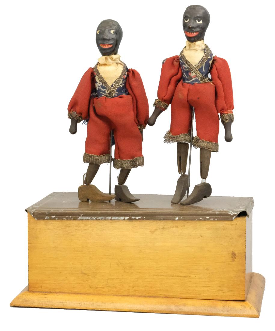 The Double Dancers: Ives, Blakeslee & Company Bridgeport, CT - Circa 1880's This is an upgraded model with a tinplate top and three dimensional figures. Material: Tin, papier mache, wood & fabric