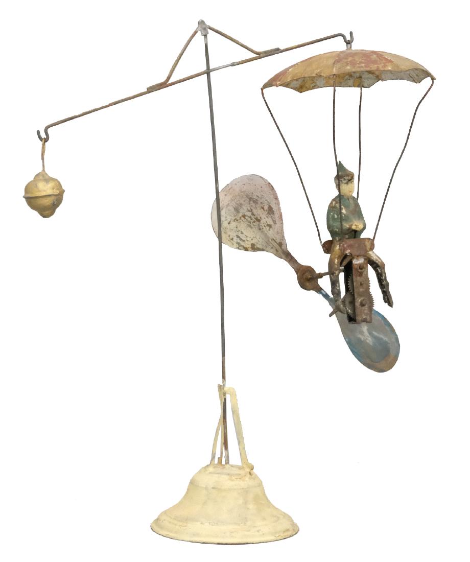Parachute Go Round: Mueller & Kadaderer German - Circa 1910 - 12.25" T This is a classic toy with wonderful kinetic movement. The base and part of figure were restored long ago. Material: Tin