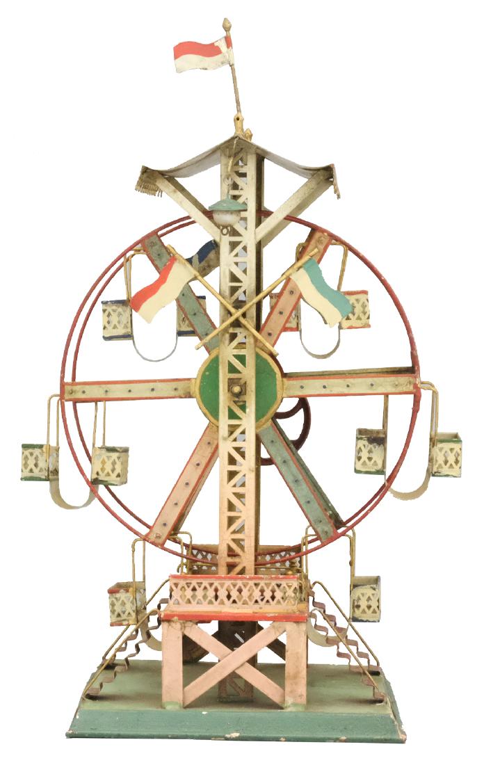 Ferris Wheel with Six Double Gondolas: Doll & Cie Co. German - Circa 1915 - 16" T The second largest of Doll & Cie's series of ferris wheels. This one is Excellent, but needs to be cleaned. Material: Tin