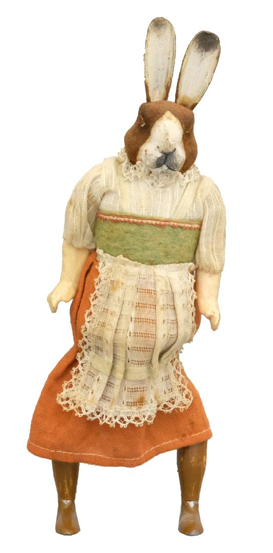 Madame Rabbit: German - Circa 1920's - 10" T This young lady is in choice and bright condition. Material: Lead, papier mache and fabric