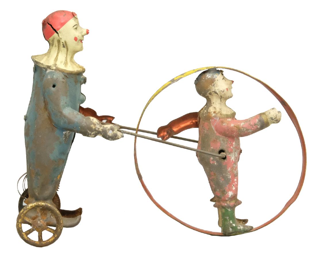 Double Clown Hoop Toy: S.G. Gunthermann German - Circa 1910's - 7.5" L Material: Tin