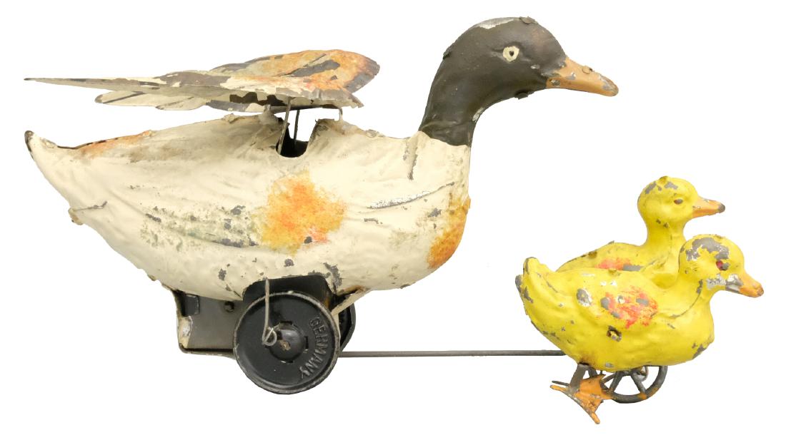 Duck and Ducklings: S.G. Gunthermann German - Circa 1920's This is an excellent example of the scarce and colorful toy. Material: Tin