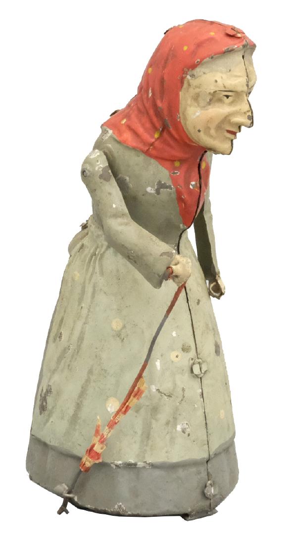 Old Woman with Umbrella: S.G. Gunthermann German - 1910's - 6.75" T Material: Tin