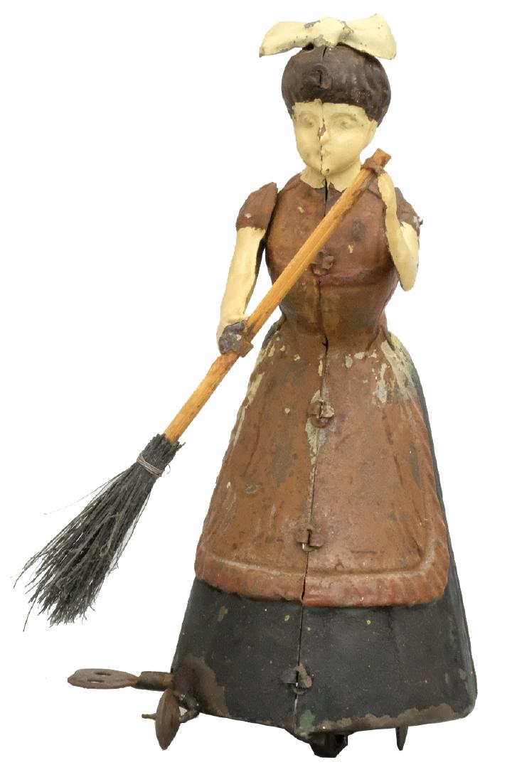 Sweeping Woman: S.G. Gunthermann German - 1910's - 7.25" T This is a cute toy depicting a young woman sweeping. Material: Tin